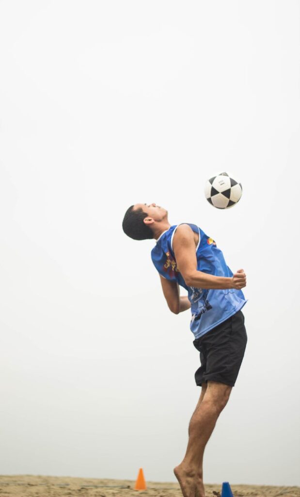man playing soccer ball